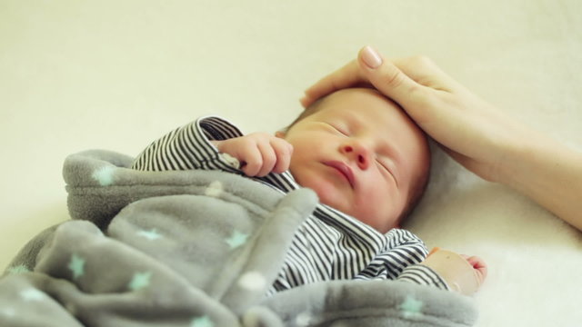 Laying sleeping newborn son