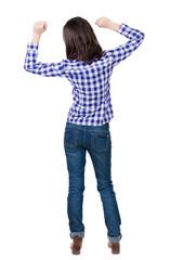 Back view of  joyful woman celebrating victory hands up