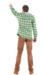 Naklejka premium Back view of pointing young men in plaid shirt with hood
