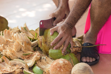 Chopping coconut by knife