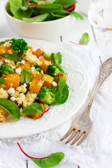 Salad with couscous, pumpkin, broccoli and feta