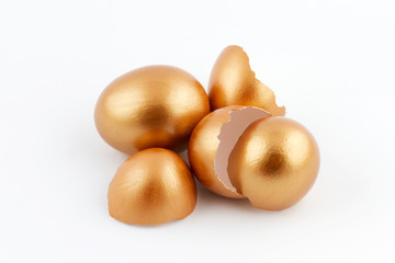 Heap of golden egg with empty broken golden eggs 
