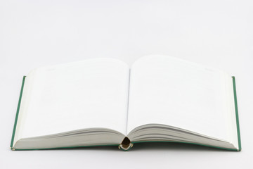 Used open empty book with green cover on white background