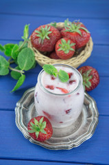 Strawberry yogurt  with fresh fruits and mint leaves