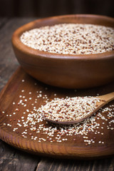 Organic quinoa grain on rustic background