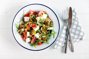 Watermelon salad with feta cheese and arugula, toasted almonds