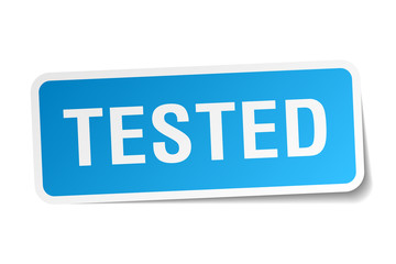 tested blue square sticker isolated on white © Aquir