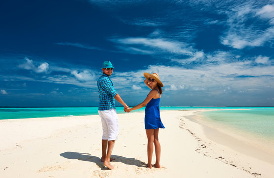 Couple in blue on a beach at Maldives