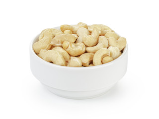dry cashew nuts in bowl on white