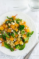 Salad with couscous, pumpkin, broccoli and feta