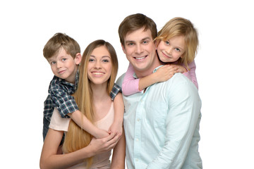 Obraz premium Cheerful young family of four enjoying time together