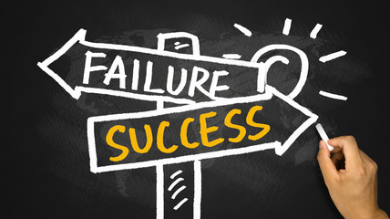 success or failure signpost hand drawing on blackboard