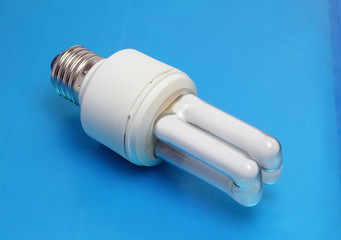 energy saving light bulb on blue background