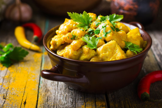 Fototapeta Spicy chicken and chickpeas curry