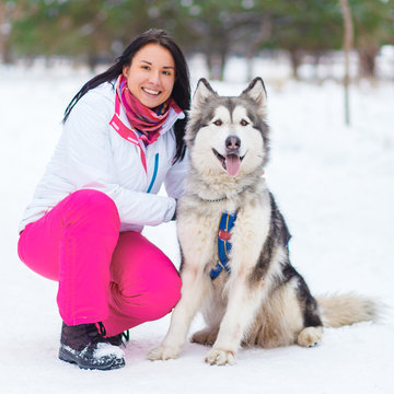 girl with malamute winter