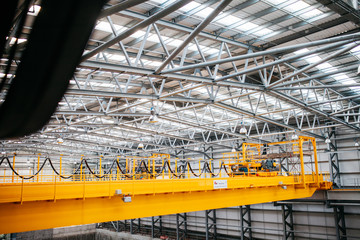 Industrial crane mechanism inside a warehouse