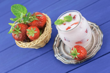 Strawberry yogurt  with fresh fruits and mint leaves