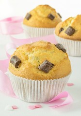 Chocolate chip muffins with pink ribbon and heart decorations