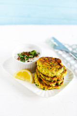 Vegetarian appetizer meal of zucchini burgers, fritters