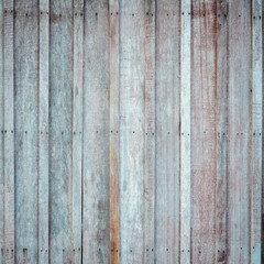 Wooden wall with the hammered rusty nails background