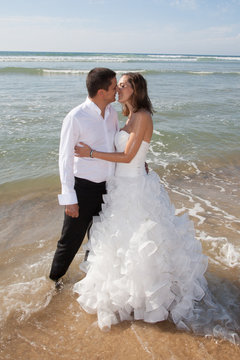 Lovely young wedding  couple on the beach