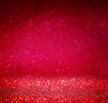 glitter vintage lights background. red and purple. defocused