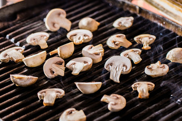 Champignon mushrooms on grill