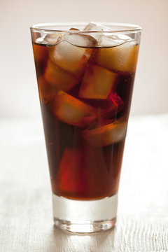 Glass of cold cola soda refreshment drink with bubbles
