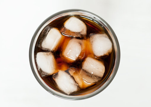 Glass of refreshing cold cola sweet soda drink