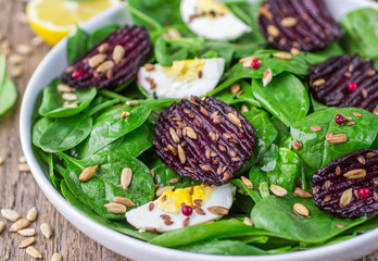 Fresh spinach salad, eggs and roasted beets