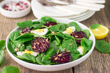 Fresh spinach salad, eggs and roasted beets
