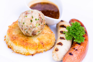 Grilled assorted sausages with spices sauce