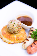 grilled assorted sausages with spices sauce