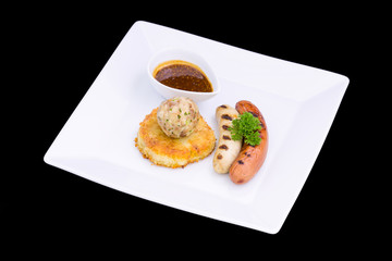 grilled assorted sausages with spices sauce