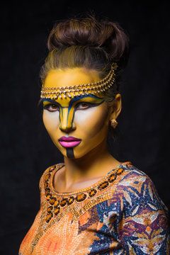 Beautiful woman with tribal face make up