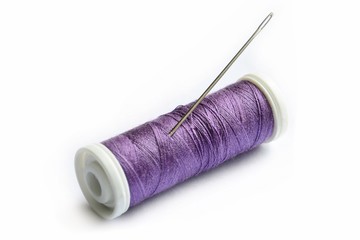 Spool of thread and needle