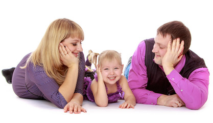 Happy parents admire its charming little daughter