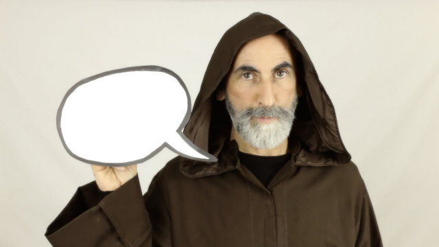 Friar holding white speech balloon showing