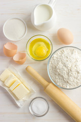Fototapeta na wymiar Ingredients for baking on the white wooden table
