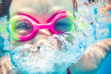 Underwater portrait of happy child