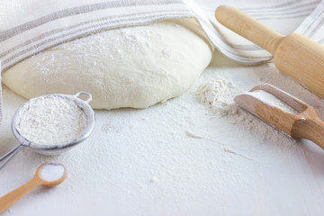 baking background.  Flour, bakeware and fresh dough