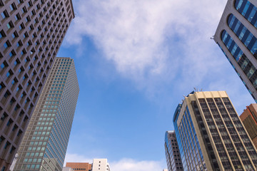 Fototapeta na wymiar skyscraper against sky and building in city