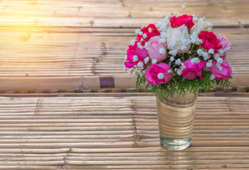 Vintage flower of the fabric on wood table