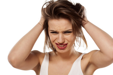 Fototapeta premium beautiful young woman has a bad headache