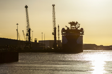 Fototapeta premium Cargo ship at sunset. Blyth. Northumberland, England.
