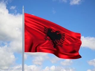 Albania 3d flag floating in the wind in blue sky