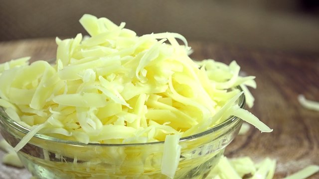 Heap of grated Cheese (seamless loopable 4K footage)