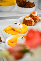 mango with coconut cream and fried potatoes ball