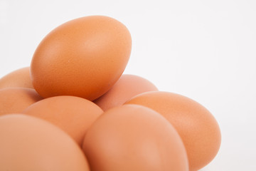 Chicken eggs  on white paper background