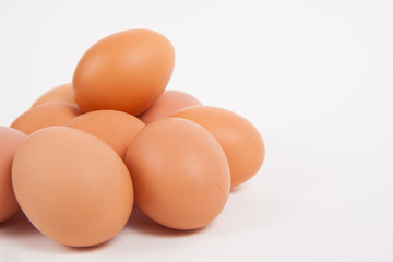 Fototapeta na wymiar Chicken eggs on white paper background